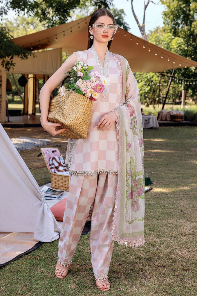 A fashion catalog page showing a woman modeling a light pink checked three-piece outfit with floral printed dupatta and pants, alongside product text and a smaller inset view. The visible brand is M.