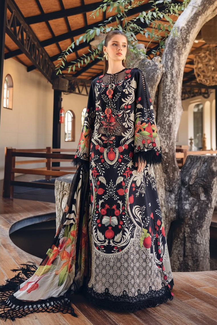 A fashion catalog page showing a model wearing an embroidered black printed gown with floral and paisley motifs, alongside a smaller inset of the same outfit and product details text for M.PRINTS 15 B.