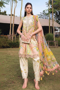 A fashion catalog page showing a woman outdoors wearing a printed traditional three-piece outfit with a matching dupatta. The outfit has a light beige base with intricate multicolor floral embroidery and a pastel pink, yellow, and green printed dupatta.
