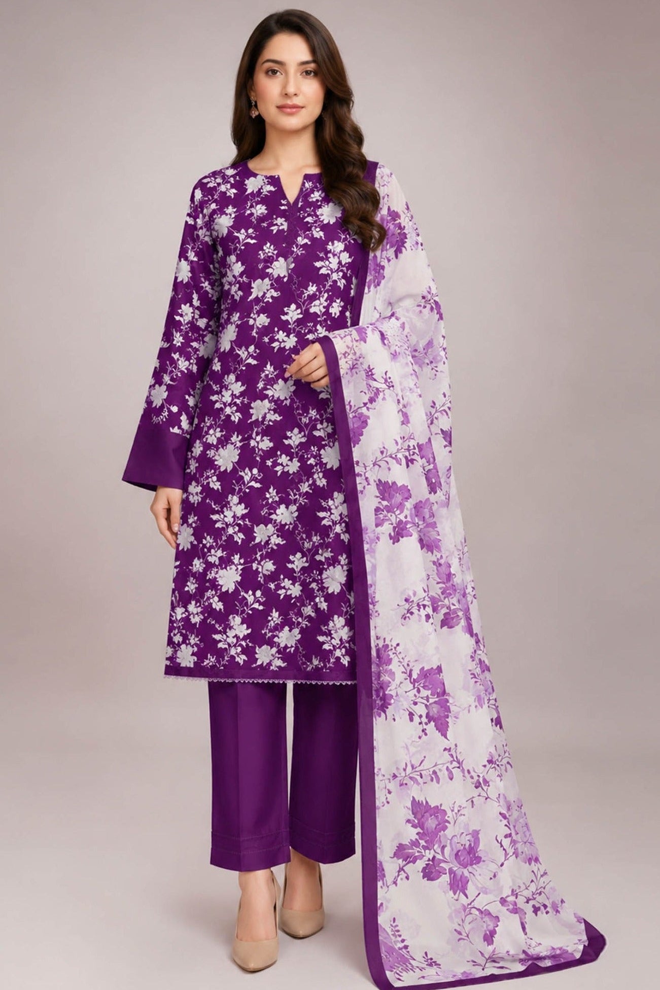 A three-piece women's ethnic suit set in purple and white, featuring a purple printed lawn shirt, matching purple trousers, and a white chiffon dupatta with purple floral patterns. The image shows a model wearing the full set in a studio setting, alongside a close-up inset of the draped dupatta, with text overlays indicating the brand 'Design Sto ck' and product details.
