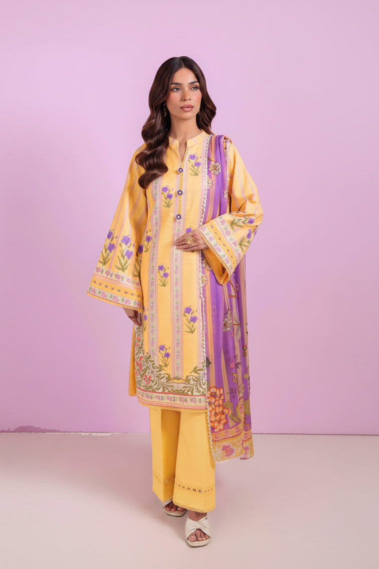 A woman modeling a three-piece yellow and purple printed ethnic suit with a dupatta, alongside product details text on a white background. The brand is Bonanza Satrangi.