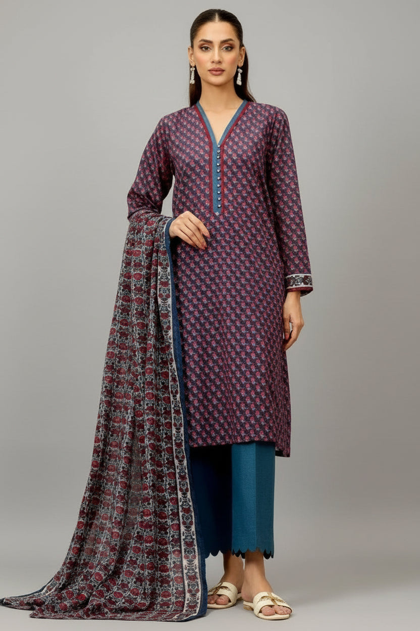 A catalog page for Orient brand women's printed shirt and trouser collection, showing two full-body views of a model wearing a purple patterned kurta with teal palazzo pants and a matching dupatta. The page includes product text, care instructions, barcode, and website information.
