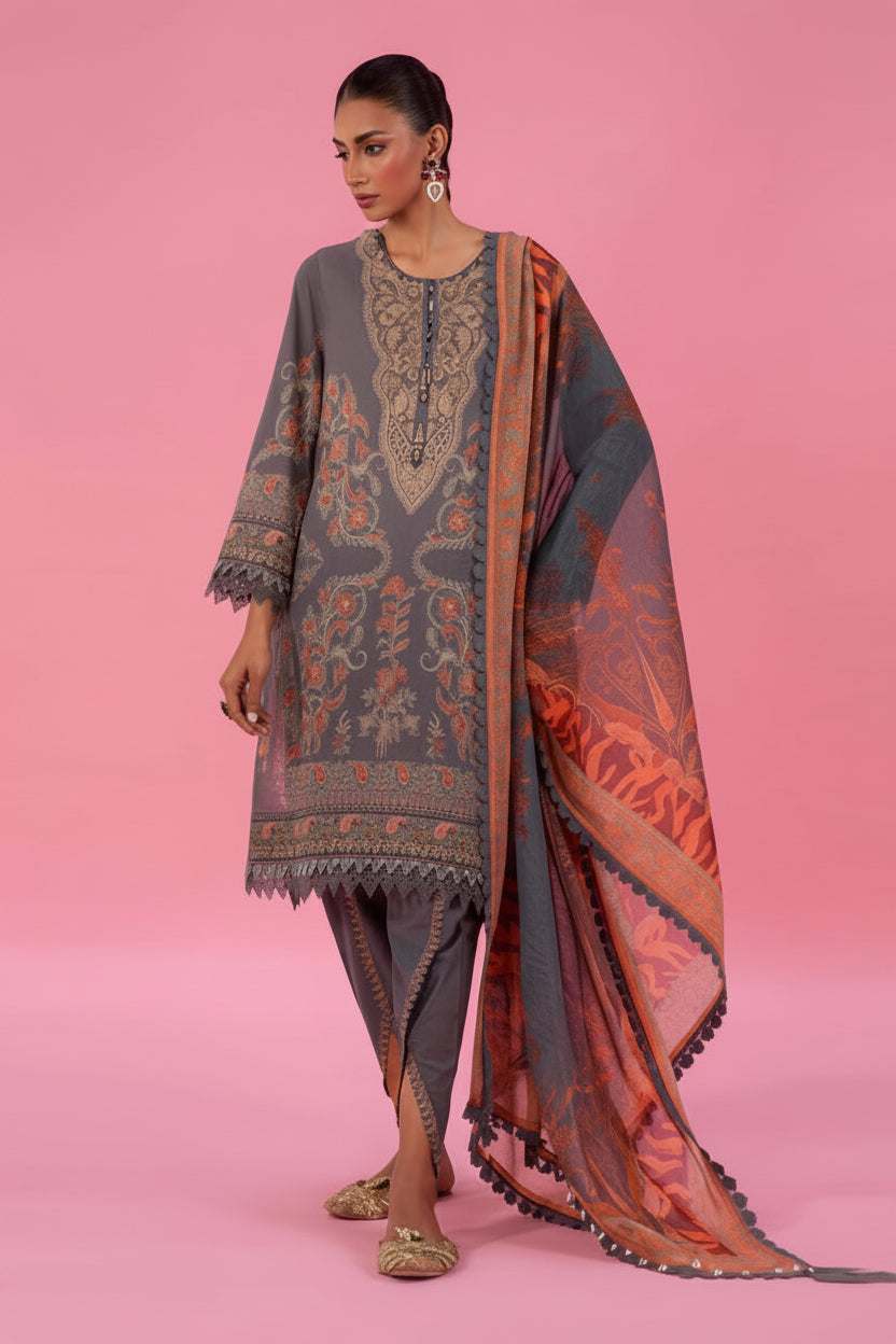 Sana Safinaz Classic-26 3-piece suit set featuring a dusty blue patterned kurta, matching trousers, and a peach and orange patterned shawl, shown on a model against a pink background with product details at the bottom.