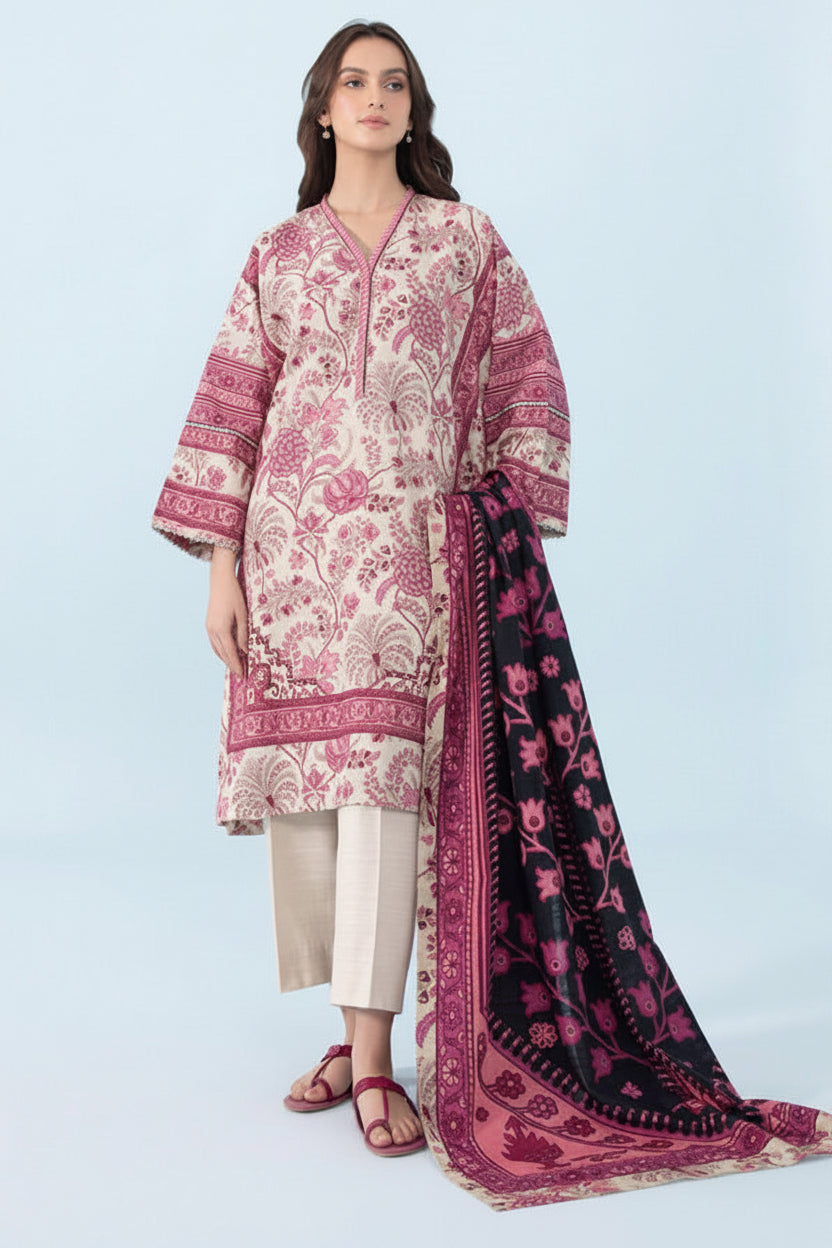 Sapphire Daily 3-piece printed lawn suit sewing pattern cover featuring a woman modeling a pink and white printed kurta, beige trousers, and a dark pink printed dupatta against a light blue studio background.