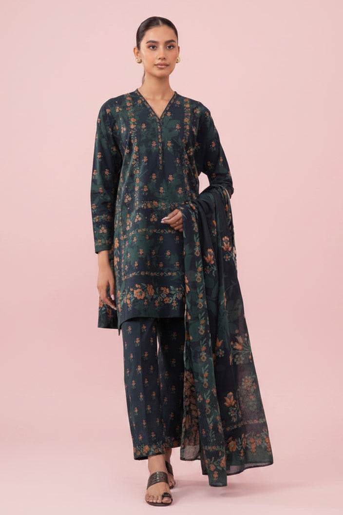 Sapphire Daily 3-piece printed lawn suit pattern cover featuring a woman modeling a dark green floral kurta, matching trousers, and a dupatta against a light pink background, with product details and a barcode on a white page.
