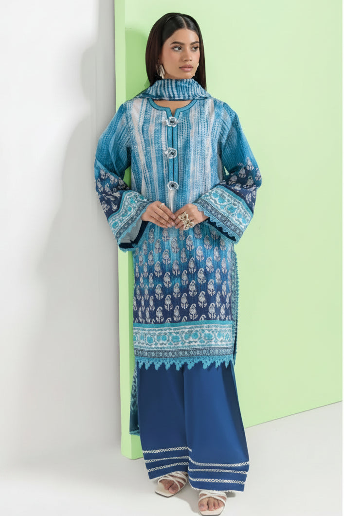 A woman modeling a three-piece traditional outfit from Bonanza Satrangi's Bohemian Vibe collection, featuring a blue and white patterned kurta, matching dupatta, and navy blue trousers, set against a split white and light green background with product details on the right.